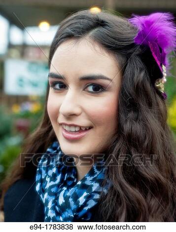 Portrait of a 21 year old brunette woman smiling at the camera View Large Photo Image Stock Photo - Portrait of a 21 year old brunette woman smiling at the camera. Fotosearch