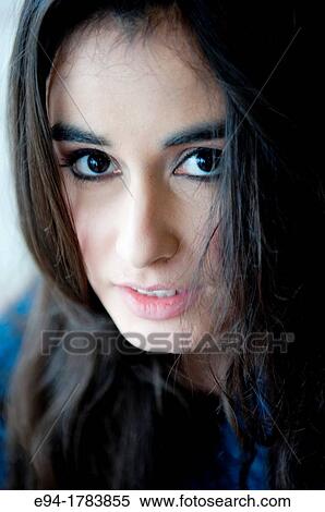 Portrait of a 21 year old brunette woman looking direrctly at the camera View Large Photo Image Stock Photography - Portrait of a 21 year old brunette woman looking direrctly at the camera. Fotosearch