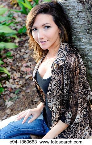 Portrait of a 21 year old woman in a garden setting in the fall View Large Photo Image Stock Image - Portrait of a 21 year old woman in a garden setting in the fall. Fotosearch