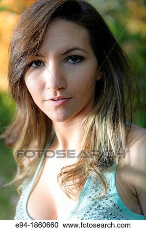 Portrait of a 21 year old woman outdoors View Large Photo Image Stock Image - Portrait of a 21 year old woman outdoors. Fotosearch