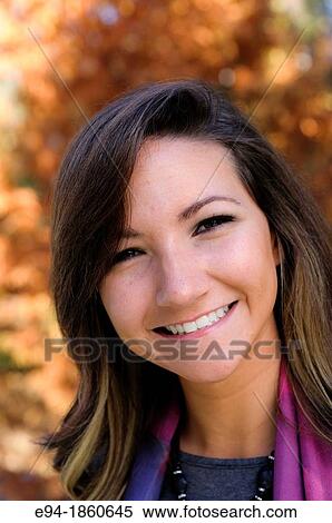 Portrait of a 21 year old woman outdoors holding a cup of tea View Large Photo Image Stock Photography - Portrait of a 21 year old woman outdoors holding a cup of tea. Fotosearch