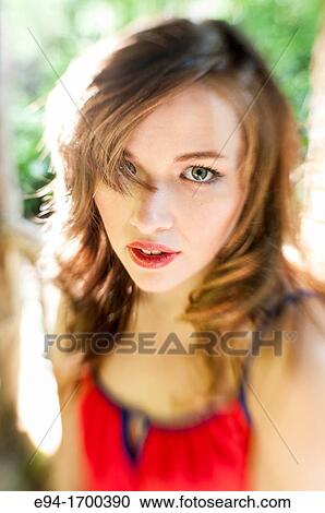 Portrait of a 22 year old brunette woman outdoors View Large Photo Image Stock Image - Portrait of a 22 year old brunette woman outdoors. Fotosearch