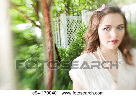 Portrait of a 22 year old brunette woman outdoors View Large Photo Image Stock Image - Portrait of a 22 year old brunette woman outdoors. Fotosearch