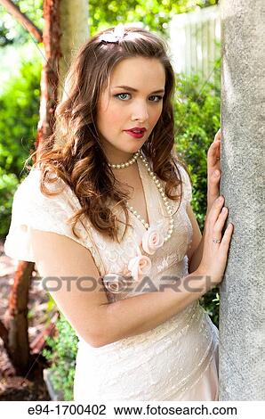 Portrait of a 22 year old brunette woman outdoors View Large Photo Image Stock Image - Portrait of a 22 year old brunette woman outdoors. Fotosearch