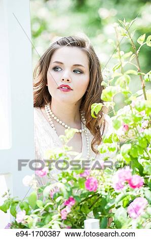 Portrait of a 22 year old brunette woman outdoors View Large Photo Image Stock Photo - Portrait of a 22 year old brunette woman outdoors. Fotosearch