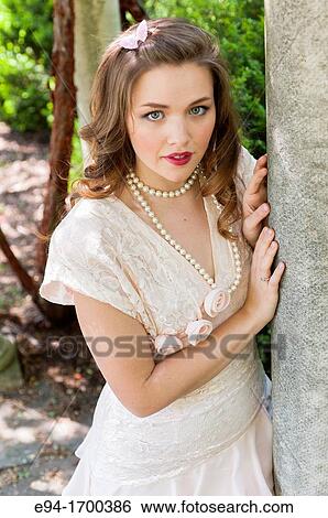 Portrait of a 22 year old brunette woman outdoors View Large Photo Image Stock Photograph - Portrait of a 22 year old brunette woman outdoors. Fotosearch