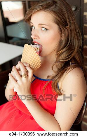 Portrait of a 22 year old brunette woman outdoors with an ice cream cone View Large Photo Image Stock Photograph - Portrait of a 22 year old brunette woman outdoors with an ice cream cone. Fotosearch