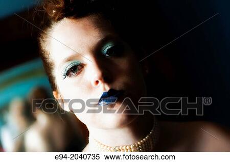 Portrait of a 22 year old brunette woman looking at the camera, half of face in deep shadow. View Large Photo Image Stock Photography - Portrait of a 22 year old brunette woman looking at the camera, half of face in deep shadow.. Fotosearch