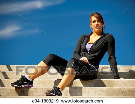 Portrait of a 23 year old brunette woman in workout clothing outdoors View Large Photo Image Stock Photo - Portrait of a 23 year old brunette woman in workout clothing outdoors. Fotosearch