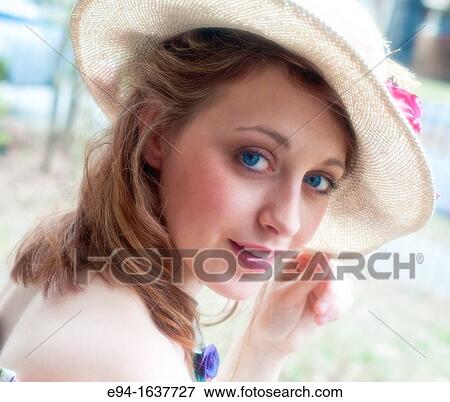 Portrait of a 24 year old blond woman wearing a straw hat looking directly at camera. View Large Photo Image Stock Photo - Portrait of a 24 year old blond woman wearing a straw hat looking directly at camera.. Fotosearch