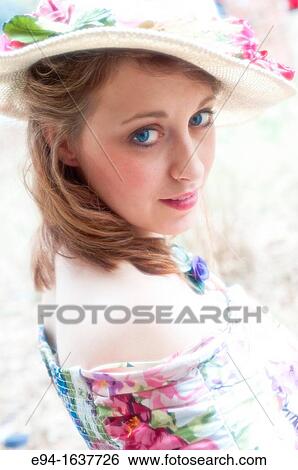Portrait of a 24 year old blond woman wearing a straw hat looking directly at camera. View Large Photo Image Stock Photograph - Portrait of a 24 year old blond woman wearing a straw hat looking directly at camera.. Fotosearch