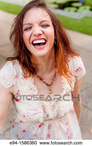 Portrait of a 24 year old brunette woman laughing at the camera View Large Photo Image Stock Image - Portrait of a 24 year old brunette woman laughing at the camera. Fotosearch