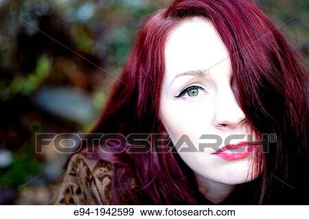 Portrait of a 24 year old red headed woman outdoors. View Large Photo Image Stock Photo - Portrait of a 24 year old red headed woman outdoors.. Fotosearch