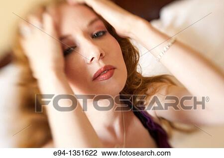 Stock Image - Portrait of a 28 year old redheaded woman. Fotosearch