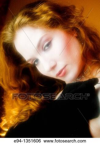 Stock Photograph - Portrait of a 28 year old redheaded woman. Fotosearch