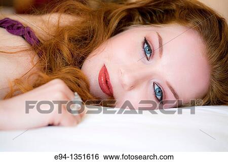 Stock Photograph - Portrait of a 28 year old redheaded woman. Fotosearch