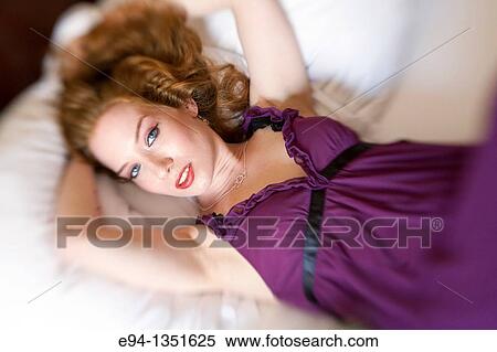 Stock Photography - Portrait of a 28 year old redheaded woman. Fotosearch
