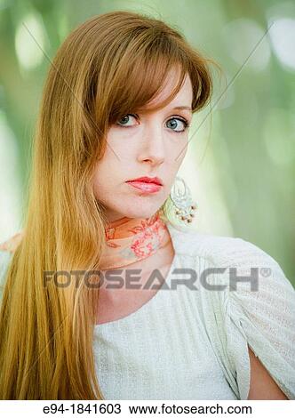 Portrait of a 30 year old redheaded woman outdoors View Large Photo Image Stock Image - Portrait of a 30 year old redheaded woman outdoors. Fotosearch