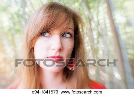 Portrait of a 30 year old redheaded woman outdoors View Large Photo Image Stock Photo - Portrait of a 30 year old redheaded woman outdoors. Fotosearch