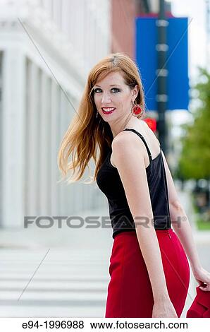Portrait of a 31 year old red headed woman in an urban setting. View Large Photo Image Stock Photo - Portrait of a 31 year old red headed woman in an urban setting.. Fotosearch
