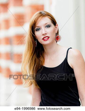 Portrait of a 31 year old red headed woman in an urban setting. View Large Photo Image Stock Photograph - Portrait of a 31 year old red headed woman in an urban setting.. Fotosearch