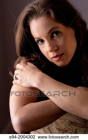 Portrait of a 37 year old brunette woman looking at the camera. View Large Photo Image Stock Image - Portrait of a 37 year old brunette woman looking at the camera.. Fotosearch