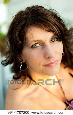 Portrait of a 39 year old brunette woman in casual clothing in a garden setting View Large Photo Image Stock Image - Portrait of a 39 year old brunette woman in casual clothing in a garden setting. Fotosearch