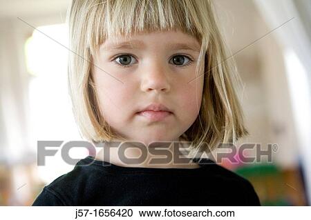 Portrait of a 4 year old girl in a black shirt with blond straight hair looking engagingly into the camera View Large Photo Image Stock Image - Portrait of a 4 year old girl in a black shirt with blond straight hair looking engagingly into the camera. Fotosearch