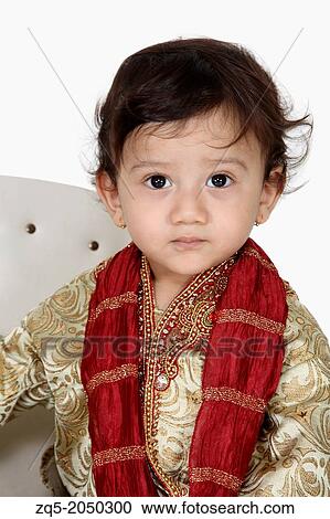 Stock Image - Portrait of a 4 year old indian boy in traditional attire. Pune India. Fotosearch