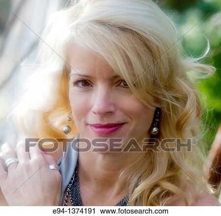 Portrait of a 44 year old blond woman, outdoors View Large Photo Image Stock Image - Portrait of a 44 year old blond woman, outdoors. Fotosearch