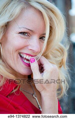 Portrait of a 44 year old blond woman, outdoors View Large Photo Image Stock Image - Portrait of a 44 year old blond woman, outdoors. Fotosearch