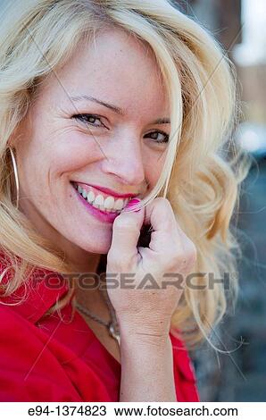 Portrait of a 44 year old blond woman, outdoors View Large Photo Image Stock Image - Portrait of a 44 year old blond woman, outdoors. Fotosearch