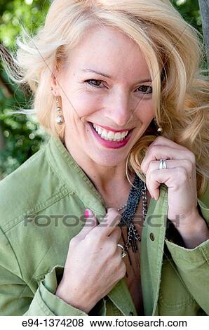 Portrait of a 44 year old blond woman, outdoors View Large Photo Image Stock Photo - Portrait of a 44 year old blond woman, outdoors. Fotosearch