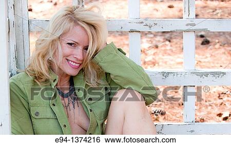 Portrait of a 44 year old blond woman, outdoors View Large Photo Image Stock Photograph - Portrait of a 44 year old blond woman, outdoors. Fotosearch