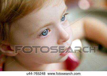 Portrait of a baby girl looking far away View Large Photo Image Stock Photo - Portrait of a baby girl looking far away. Fotosearch