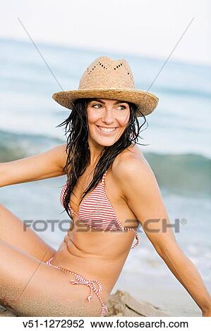 Portrait of a beautiful brunette woman at the beach View Large Photo Image Stock Image - Portrait of a beautiful brunette woman at the beach. Fotosearch