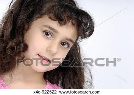 Portrait Of A Beautiful Five Year Old Girl With Dark Curly Hair