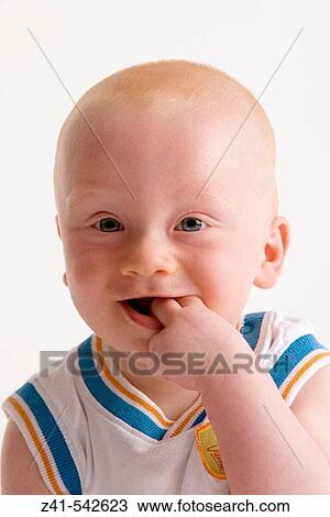 Stock Image - Portrait of a blond baby boy.. Fotosearch