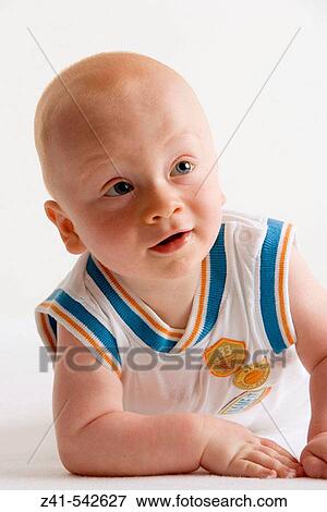 Stock Photo - Portrait of a blond baby boy.. Fotosearch