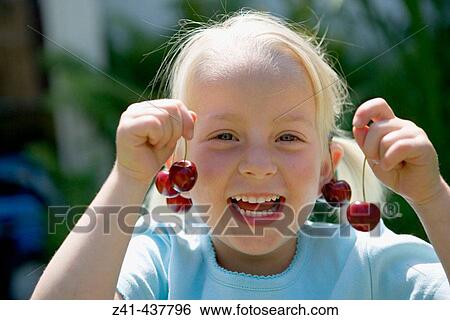 Portrait of a blond girl with cherries View Large Photo Image Stock Photograph - Portrait of a blond girl with cherries. Fotosearch