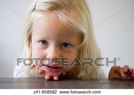Portrait of a blond little girl View Large Photo Image Stock Image - Portrait of a blond little girl. Fotosearch