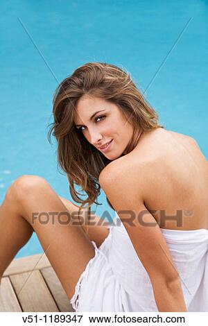 Portrait of a blond woman in the pool looking at camera View Large Photo Image Stock Photo - Portrait of a blond woman in the pool looking at camera. Fotosearch