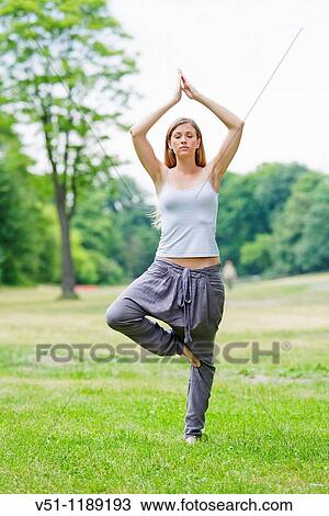 Portrait of a blonde woman doing yoga in the park View Large Photo Image Stock Image - Portrait of a blonde woman doing yoga in the park. Fotosearch
