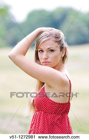 Portrait of a blonde woman in the park View Large Photo Image Stock Image - Portrait of a blonde woman in the park. Fotosearch