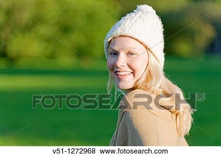 Portrait of a blonde woman with a hat smiling at camera View Large Photo Image Stock Photo - Portrait of a blonde woman with a hat smiling at camera. Fotosearch