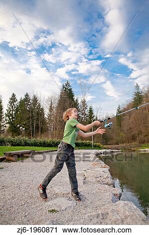 Portrait of a boy fishing trouts in the lake. Slovenia. View Large Photo Image Stock Image - Portrait of a boy fishing trouts in the lake. Slovenia.. Fotosearch