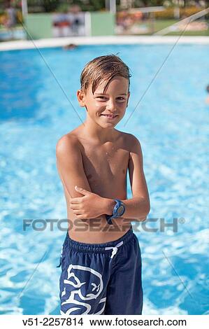 Picture - Portrait of a boy in a swimming pool. Fotosearch