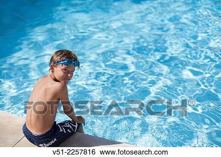 Portrait of a boy in a swimming pool View Large Photo Image Stock Photograph - Portrait of a boy in a swimming pool. Fotosearch