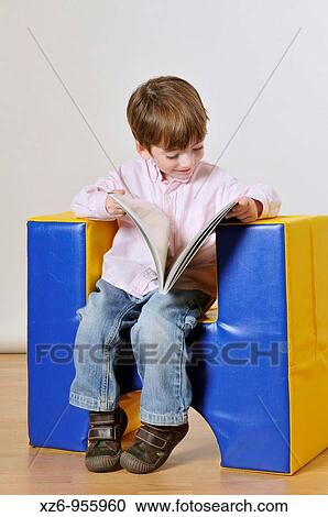 Portrait of a boy reading View Large Photo Image Stock Image - Portrait of a boy reading. Fotosearch