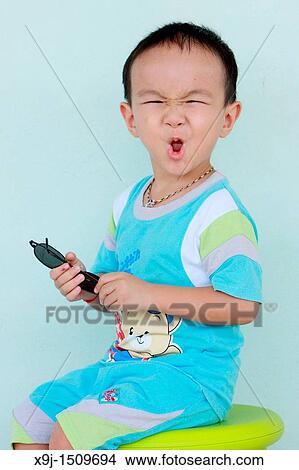 Portrait of a boy with funny face View Large Photo Image Picture - Portrait of a boy with funny face. Fotosearch